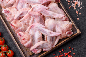 Fresh chicken wings with salt, spices and herbs