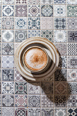 cappuccino on the tile table