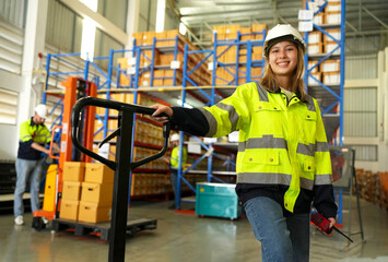 Warehouse worker working in warehouse storage. Foreman or worker work at factory site check up...