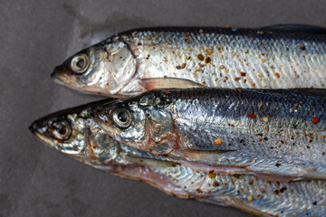 three fish close-up. marinated fish in spice