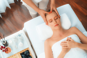 Panorama top view of woman enjoying relaxing anti-stress head massage and pampering facial beauty...
