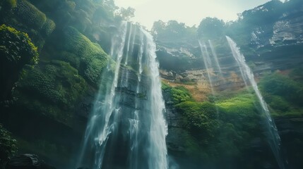 Beautiful waterfall on the plain. Mountain valley waterfall. view of waterfall in green valley