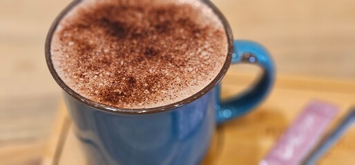 Refreshing Blue Cup with Spoon on Wooden Table