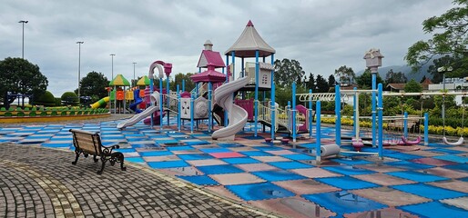 Vibrant Playground with Slide, Climbing Structure, and Carousel