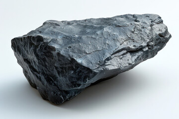A black asteroid rock isolated on a plain white background