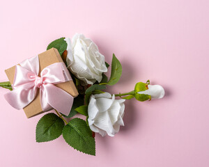 Creative layout made with flowers on pink backdrop. Spring minimal concept.