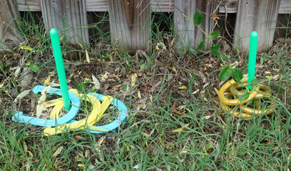neglected ring toss game in grass