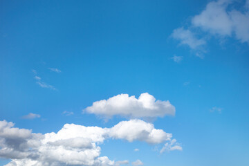 Obraz premium Blue sky background with clouds clouds with shapes.
