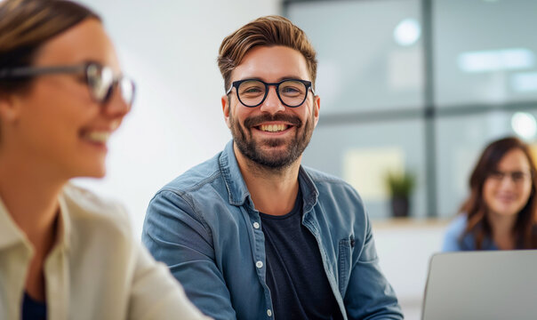 Handsome man working on a modern office, good teammate, collaboration on a happy team. Marketing, computer, law, paralegal, technology, 