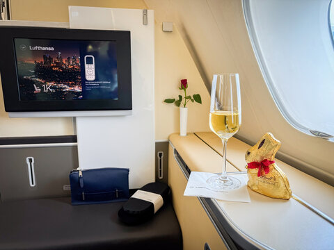 Munich, Germany - March 29, 2024: Lufthansa First Class seat 1K in an Airbus A380 with easter chocolate bunny