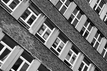 ARCHITECTURE - Brick wall and windows of an old modernist building