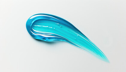 Detailed close-up view of a transparent sky blue serum smudge resting on a clean white surface