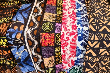 Close up view of African Ghanaian traditional multi colour and multi pattern cotton print cloths