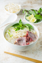 pho bo, vietnamese raw beef and rice noodle shoup