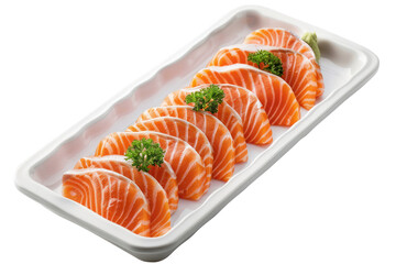 A tray holding fresh raw salmon pieces topped with vibrant parsley leaves ready to be prepared