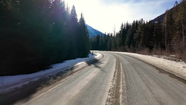Scenic Highway surrounded by Mountains, Trees and Snow. Daytime, Duffy Lake Road. Near Pemberton and Lillooet, British Columbia, Canada.