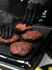 chef frying grilled hamburgers