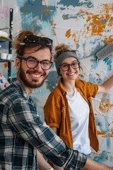 Obraz premium a couple in love is making repairs in the house