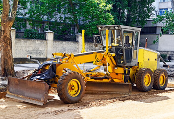 Grader on road construction site