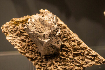 Golden pyrite on the black background. Fool's gold, luxury, sulfide gemstone texture