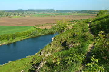 A river running through a grassy area