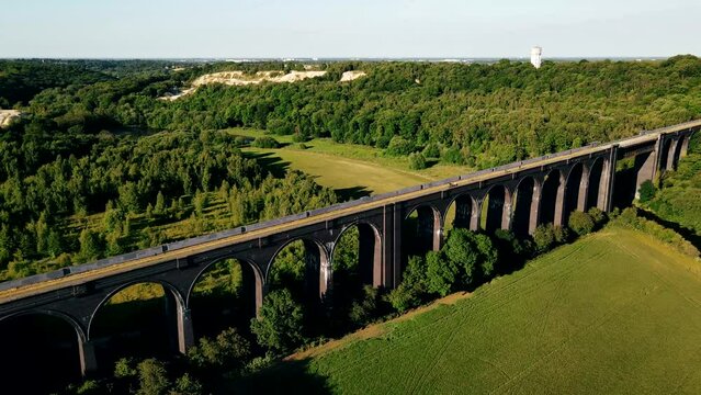 A drone view of the Conisbrough Viaduct and the girder span over the River Don at Conisbrough, Yorkshire, UK in summer time