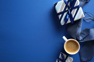 Happy Fathers Day concept. Flat lay retro gift boxes, coffee cup, tie, glasses on dark blue background.