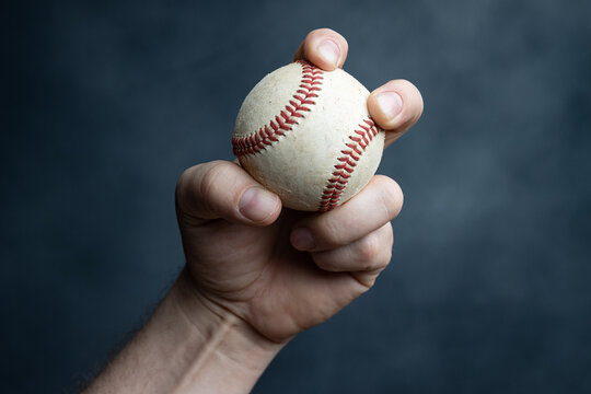 Fastball grip variation; baseball in hand.