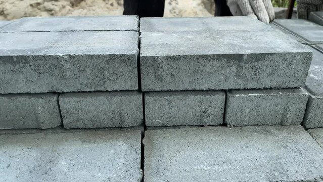 Brickwork process with trowel, closeup view and only hands visible