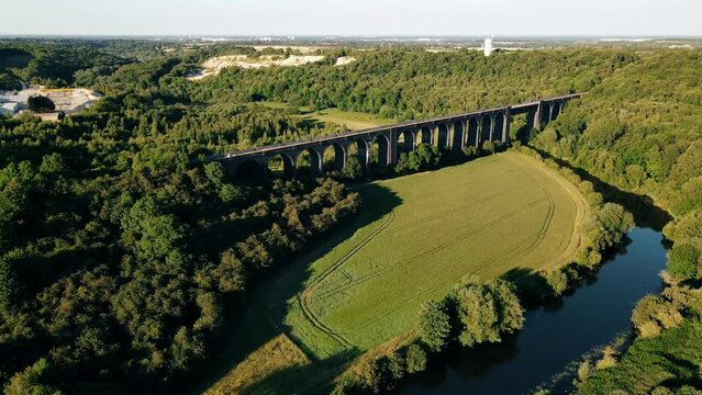 A drone view of the Conisbrough Viaduct and the girder span over the River Don at Conisbrough, Yorkshire, UK in summer time