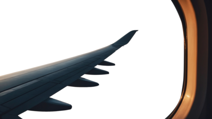 Wing of a plane flying over the clouds at sunset or sunrise.travel concept