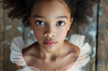 Stunning high-resolution photographs of a biracial young ballerina preparing to take the stage for her ballet exam capture excitement and emotion.