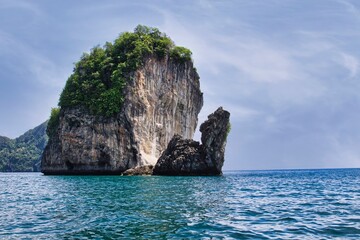 The famous Phi Phi Islands near Puchet (Thailand) are renowned for their stunning beauty, boasting turquoise waters, pristine beaches, spectacular limestone cliffs and lush greenery