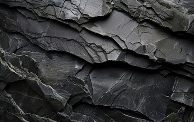 Textured dark grey slate with natural intricate line patterns.