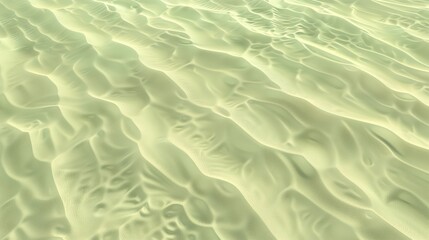 A texture of ripples on sand, with small waves on the surface, light green tint.