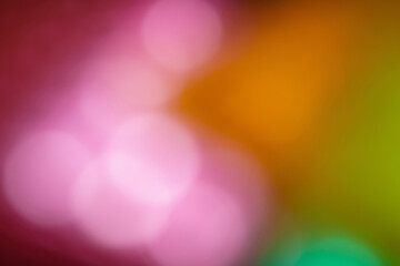 Pink and orange abstract background defocused light blur circles spring, summer or holiday...