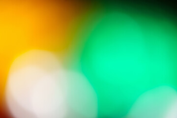 Soft abstract spring green background soothing colors of nature with orange and white. High resolution can be cropped many ways. 
