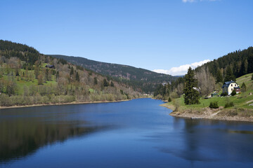 Fototapeta premium Spindleruv Mlyn, Czech Republic - April 27, 2024 - The Labska Reservoir or Labska Dam near Spindleruv Mlyn at the beginning of spring