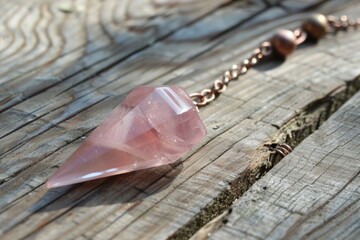 A beautiful rose quartz pendulum pendant on a delicate chain. Perfect for crystal healing practices