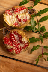 Pomegranate, a beautiful pomegranate on rustic wood, selective focus.