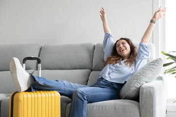 Woman posing happy ready to travel with suitcase