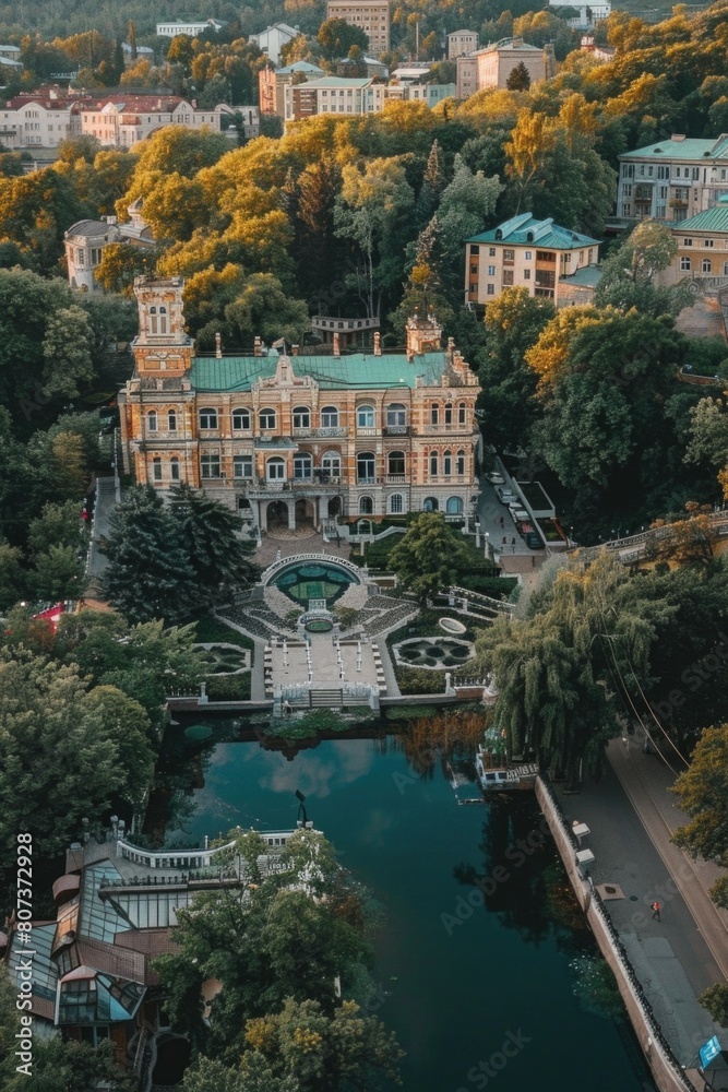 Poster Aerial view of a building surrounded by trees, suitable for architectural and environmental themes