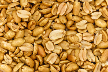roasted salted peanuts photographed close-up on a white background
