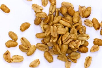roasted salted peanuts photographed close-up on a white background
