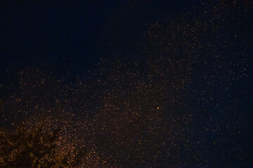 Fire embers particles over black background. Fire sparks background. Czech