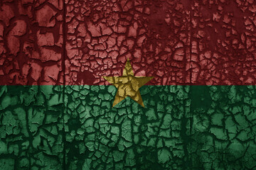 flag of burkina faso on a old grunge metal rusty cracked wall background