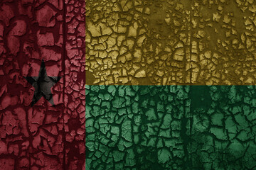 flag of guinea bissau on a old grunge metal rusty cracked wall background