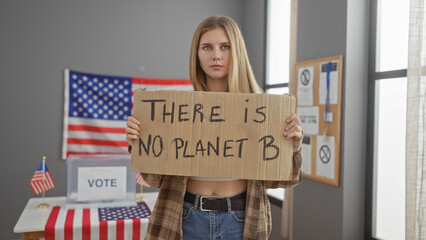 A young woman holding a protest sign 'there is no planet b' stands in a usa voting center, symbolizing environmental activism.