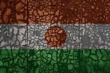 flag of niger on a old grunge metal rusty cracked wall background