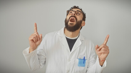 Enthusiastic mature man in lab coat pointing upwards, expressing an idea on white background